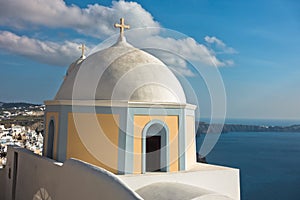 Dome of a church at Oia village with view on Caldera at background, Santorini island