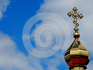 Dome with a cross of the Christian church against the sky