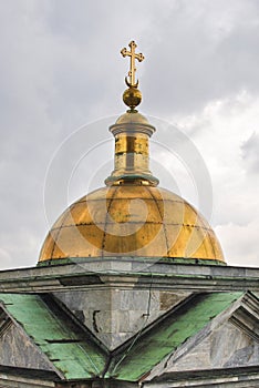 Dome with a cross of St. Isaac`s Cathedral in St. Petersburg, Russia
