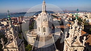 Dome of the Estrela Basilica on a background Lisbon at morning aerial view