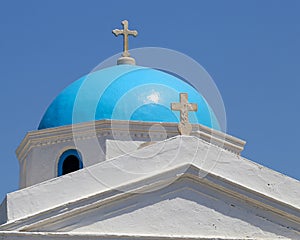 Dome of Greek Orthodox church of Mykonos against the blue sky