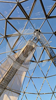 Dome made of triangles on a lookout tower against a blue sky