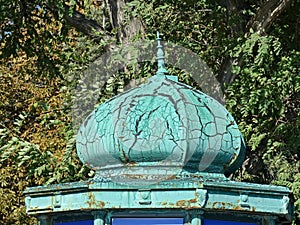 The dome on the old gazebo. The dome-onion has a convex shape, smoothly pointed at the top, similar to the onion.