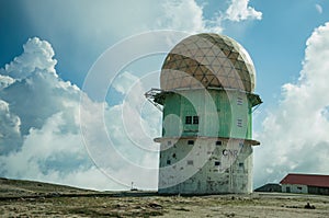 Dome of old radar station on rocky landscape