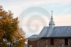 Dome with orthodox cross and ancient thousand years brick masonry wall of St Boris and Gleb or Kalozhskaya Church in