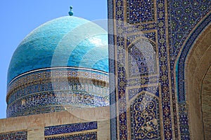 The dome and portal of a Koranic school in Bukhara photo