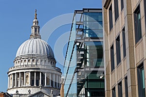 Dome of Saint Paul Cathedral through modern buidlings