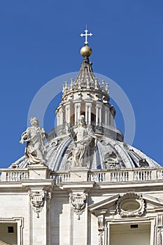 Dome of Saint Peter`s Basilica at St.Peter`s square on background of blue sky, Vatican, Rome, Italy