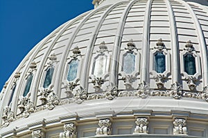 Dome of The United States Capitol under the sunlight and a blue sky in Washington DC