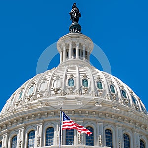 Dome of the Us Capitol at Washington with a United States Flag