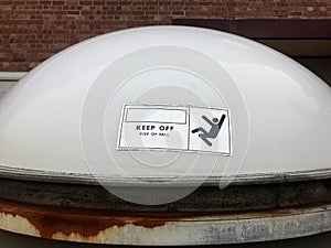 Domed translucent perspex skylight on a building roof photo