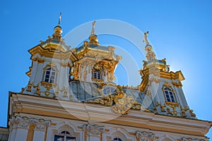 The domes of the church building. The domes are covered with gilding, they are crowned with crosses. Petergof, Russia
