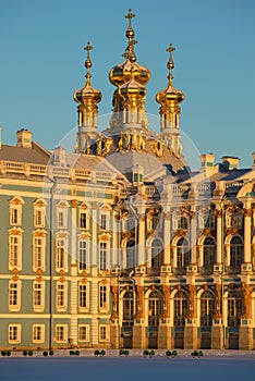 Domes of Church of the Resurrection of Catherine Palace in beams of the sunset sun. Tsarskoye Selo, Russia