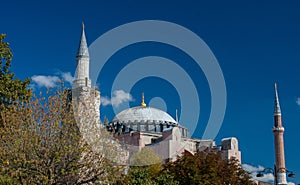 Domes and minarets of Haggia Sophia Museum against a blue sky in Istanbul, Turkey