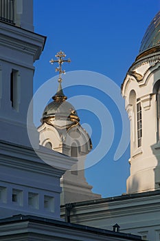 Domes of an Orthodox church with crosses against a blue sky