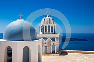 Domes on the rooftop of the Church of St. Mark the Evangelist and the Aegean Sea on the Fira City at Santorini Island