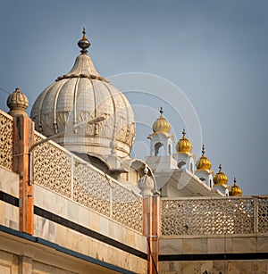 Domes of Sikh Temple glisten in sunshine in Delhi .tif