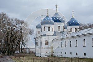 Domes of Yuriev Monastery on a background of cloudy sky
