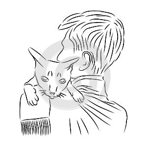 Domestic cat sits on shoulder of its owner. Showing love and caresses to pet. Animal care, welfare and protection