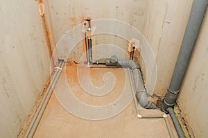 Domestic plumbing and sewage pipes connections in house construction.