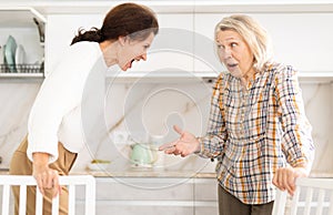 Domestic quarrel - elderly mother quarrels with her adult daughter and starts screaming