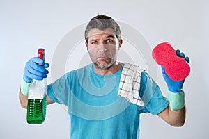 Domestic service man or tired husband angry and stressed house cleaning with spray bottle and sponge