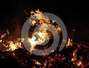 Domestic waste debris burns in fire detailed