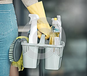 Domestic worker, maid or cleaner hands holding or carrying cleaning products and equipment or supplies. For home hygiene