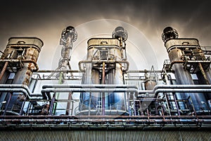 Dominating industrial facility with dramatic sky