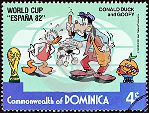 DOMINICA - CIRCA 1982: A stamp printed in Dominica shows Donald Duck and Goofy as park attendant, circa 1982.