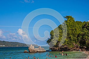 Dominican Republic. 20 NOVEMBER 2021. Caribbean beach with a lot of palms and white sand, sunbeds. Sunny warm day at the sea under