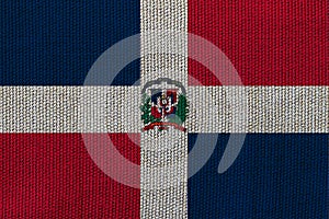 Dominicana flag on the background texture. Concept for designer solutions