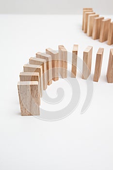 Domino effect - row of white dominoes on white background