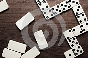 Domino pieces on the wooden table background