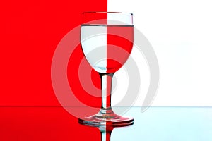 Domino wine glasses on the red and white backgroun