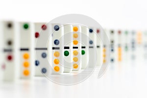 Dominoes. Dominos pieces with colorful dots in row