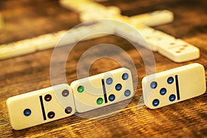 Dominoes tiles on vintage table