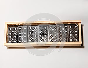 Dominoes in a wooden box