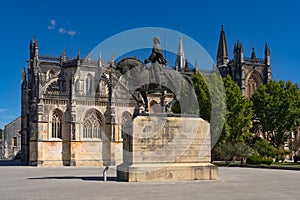 Don Nuno ÃÂlvares Pereira statue with the Batalha monastery (Santa Maria da Vitoria) in Portugal. World photo