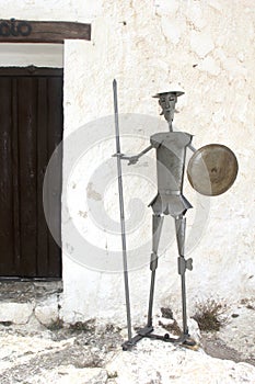 Don Quichot statue at a windmill in La Mancha, Spain photo