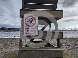 Don`t Feed Waterfowl sign on the back of a lifeguard stand at Juanita Beach Park