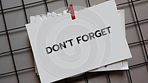 Don\'t forget hand writing on sticky note. meeting reminder notepaper business concept.