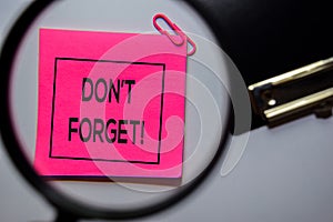 Don`t Forget text on sticky notes isolated on office desk
