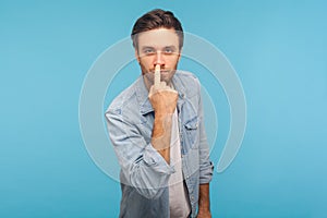 Don`t lie to me! Portrait of man in worker denim shirt touching nose, showing liar gesture, angry about falsehood photo