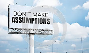 Don`t make assumptions text message on signboard with blue sky photo