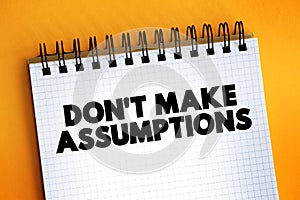Don`t Make Assumptions text on notepad, concept background photo
