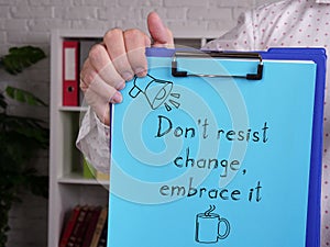 Don't resist change embrace it is shown using the text