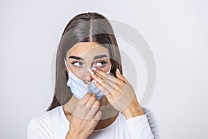 Don`t Touch Your Face. Girl wearing surgical mask rubbing her eye with dirty hands.Precautions, Avoid Touching Your Eyes. Woman i