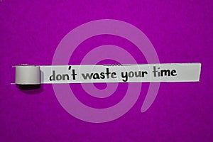 Don`t waste your time, Inspiration, Motivation and business concept on purple torn paper