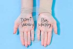 Don`t worry be happy concept on woman hands